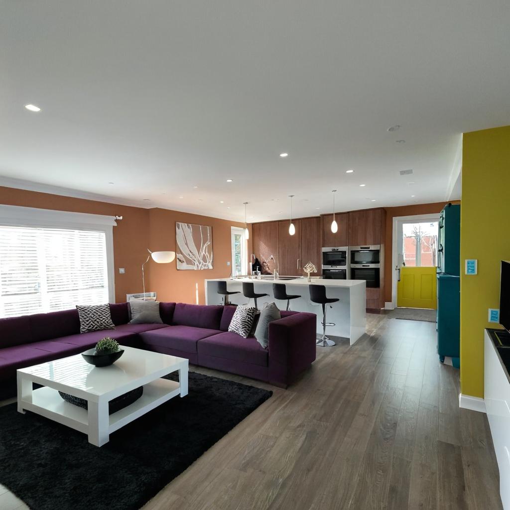 Cozy Living Room Bliss: Purple Couch & Chic Decor